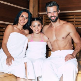 Young beautiful happy father and mother with little cute daughte